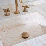 The vanity sink looks like it is carved 