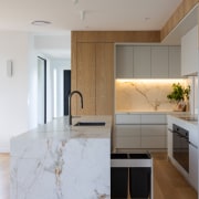 Waterfall ends add to the kitchen island's presence. 
