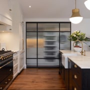 Looking across the kitchen to the reeded glass 