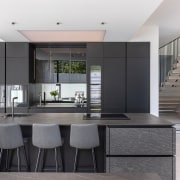 The kitchen presents as a black insert within 