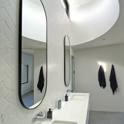 Oval mirrors work well with the rounded light 