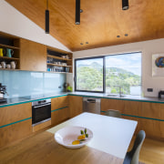 Kitchen with coastal views. - Simple, informal and 