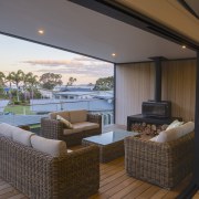 With sliders drawn back, the spacious east-facing deck 