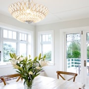 A replica Oly Pipa bowl chandelier completes the 