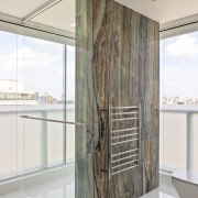 His bathroom – shower wall and toilet. - 