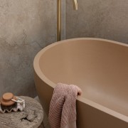 Bath and floor-mounted pourer are features of the 
