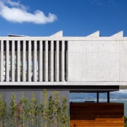 Concrete 'bars' give this part of the home architecture, building, elevation, facade, home, house, real estate, residential area, white, blue
