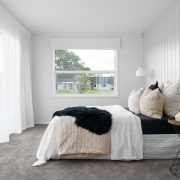 The master bedroom with generous walk-in robe and 