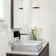 The mirror-fronted cabinet protrudes only slightly – just 