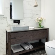 The large, custom-designed vanity includes wide drawers for 