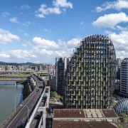 The building is designed with straight glass panels apartment, architecture, bridge, building, city, cityscape, cloud, commercial building, condominium, corporate headquarters, daytime, downtown, human settlement, infrastructure, landmark, landscape, metropolis, metropolitan area, mixed-use, neighbourhood, property, real estate, reflection, river, sky, skyline, skyscraper, tourism, tower, tower block, urban area, urban design, waterway, teal