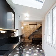 Kitchen open to the entrance and dining room, architecture, building, ceiling, daylighting, floor, flooring, furniture, hall, hardwood, home, house, interior design, lobby, property, real estate, room, stairs, tile, wood flooring, gray, white