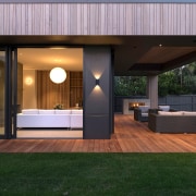 The home's generous rear outdoor living space continues 