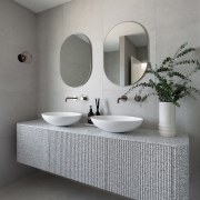 The basins are custom Corian ovals and the 