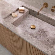 Created from the same travertine as the benchtop, 