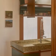 The work surface incorporates subtle set-down areas and 