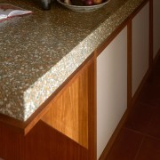 Terrazzo meets rich timber tones – island detail. 