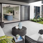 The kitchen opens to the al fresco living 