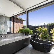 A stone freestanding tub in the master ensuite 