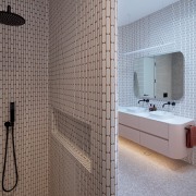 The bathroom makes a playful nod to both 