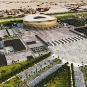 New look at Foster + Partners Lusail Stadium aerial photography, amphitheatre, arena, bird's eye view, city, mixed use, sport venue, stadium, structure, suburb, urban area, urban design, white, brown
