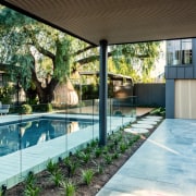 The driveway doubles as a basketball court while 