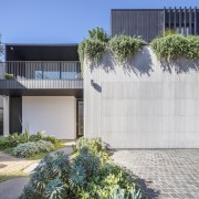 The landscaping softens the home's strong architectural lines 