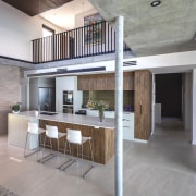 Kitchen with upstairs circulation above. - Sculpted by 