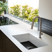 The prep sink features Staron Cotton White returned 