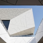 Crackling on the Opera house's facade is reminiscent architecture, ceiling, daylighting, design, line, material property, space, tile, triangle, white
