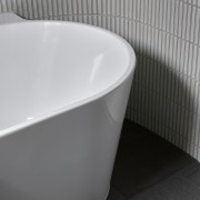 The freestanding bath was chosen for its curved 