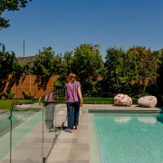 Surrounding the pool with plantings on two sides 