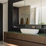 A custom, oversized basin accommodates hand-washing of garments, 