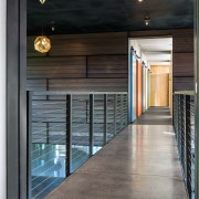 A concrete bridge with steel balustrades above this architecture, house, interior design, lobby, black, gray