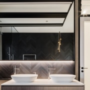 ​​​​​​​Oak-look vanity cabinet fronts complement the subtle tones architecture, bathroom design, sink, tap, gray, black, taps, vanity, Melonie Bayl-Smith,  Andrew Lee, Bijl Architecture