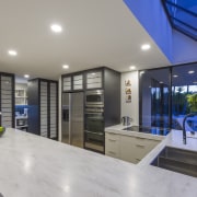 ​​​​​​​Two pantries for food and crockery flank the house, home, kitchen design, Kira Gray, Fyfe Kitchens, cabinetry, Corian benchtop