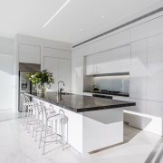 ​​​​​​​The fridge is set to the side of architecture, countertop, benchtop, interior design, kitchen, white cabinetry,  Ceasarstone, Island, Emma Morris, Eterno Design