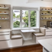 ​​​​​​​In this kitchen by designer Damian Hannah, a cabinetry, benchtop, interior design, kitchen, shelf, coffee nook, Damien Hannah