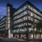 A new curtain wall reconciles the old, new apartment, architecture, building, commercial building, condominium, corporate headquarters, facade, headquarters, home, house, metropolis, metropolitan area, mixed use, neighbourhood, real estate, residential area, sky, black, blue