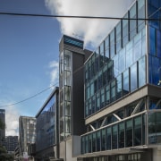 A new curtain wall was a key harmonising apartment, architecture, building, city, commercial building, condominium, corporate headquarters, daytime, facade, headquarters, house, metropolis, metropolitan area, mixed use, residential area, sky, skyscraper, window, gray, black