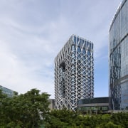 The glazed facade behind Morpheus Hotel’s exoskeleton comprises architecture, building, city, condominium, corporate headquarters, daytime, facade, headquarters, metropolis, metropolitan area, mixed use, residential area, sky, skyscraper, tower block, tree, urban area, white