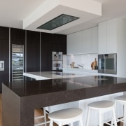 In this kitchen by Azente, the flush ventilation architecture, cabinetry, black, countertop, cupboards, floor, flooring, hardwood, kitchen, wood flooring, Akzente, Poggenpohl