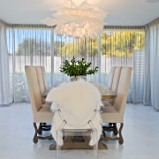 ​​​​​​​This formal dining room steps down from the chair, curtain, floor, flooring, furniture, home, house, interior design, table, textile, white, yellow, formal dining, O'Neil Architecture, Fandango lighting pendant, Hive