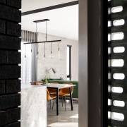 ​​​​​​​A feature wall in cast-in-situ poured concrete in architecture, floor, flooring, furniture, house, interior design, lighting, tile, wall, black, white, kitchen,  Dalecki Design