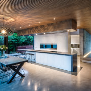 ​​​​​​​This kitchen is the hub of the home architecture, building, ceiling, countertop, design, estate, floor, flooring, furniture, home, house, interior design, kitchen, lighting, loft, property, real estate, room, table, gray