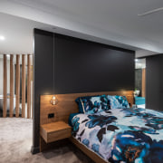 ​​​​​​​Dark wall and cabinet tones accentuate the warmth architecture, bed, bed frame, bed sheet, bedding, bedroom, building, ceiling, floor, furniture, hardwood, home, house, interior design, linens, loft, mattress, property, real estate, room, suite, wall, wood flooring, gray, black