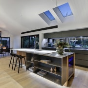 ​​​​​​​In a room with floor-to-ceiling windows, a window gray