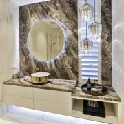 In this powder room, by Dunlop Design, the gray