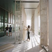 A student manipulates the moveable and replaceable aluminium architecture, building, ceiling, column, moveable facade systems,  SDE4 building