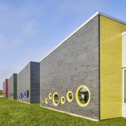 The facade of Rockford School features intriguing low-set teal